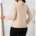 Beige ladies polka dot pleated high neck blouse with gold metallic polka dots and long sleeves