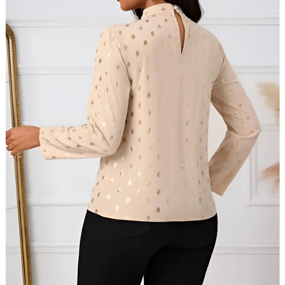 Beige ladies polka dot pleated high neck blouse with gold metallic polka dots and long sleeves