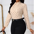 Beige ladies polka dot pleated high neck blouse with gold polka dots and long sleeves for elegant wear