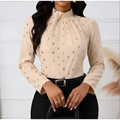 Beige ladies polka dot pleated high neck blouse with long sleeves and gold foil dot pattern