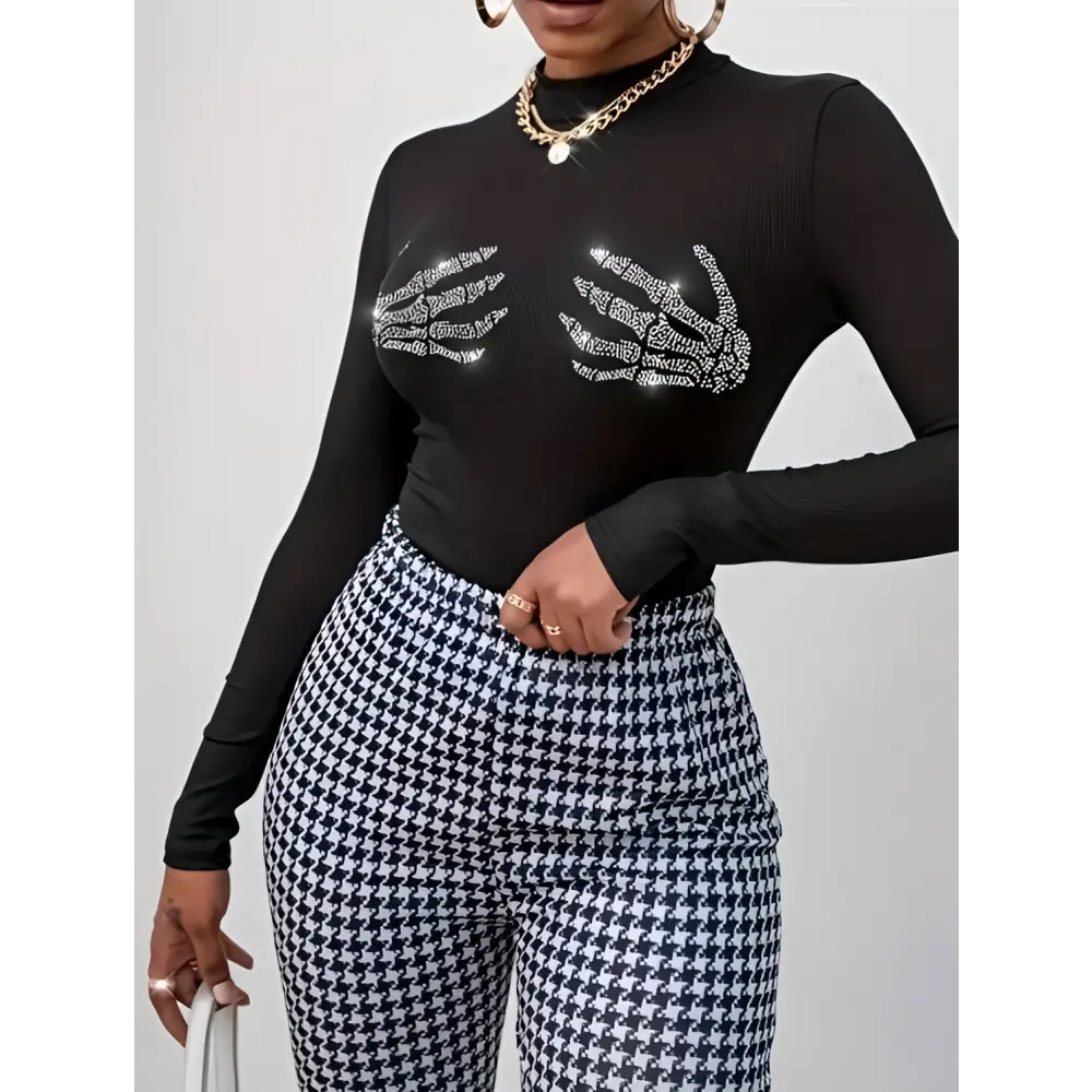 Black long sleeved mesh top with sparkling skeleton hand designs for a ladies printed fashionable look
