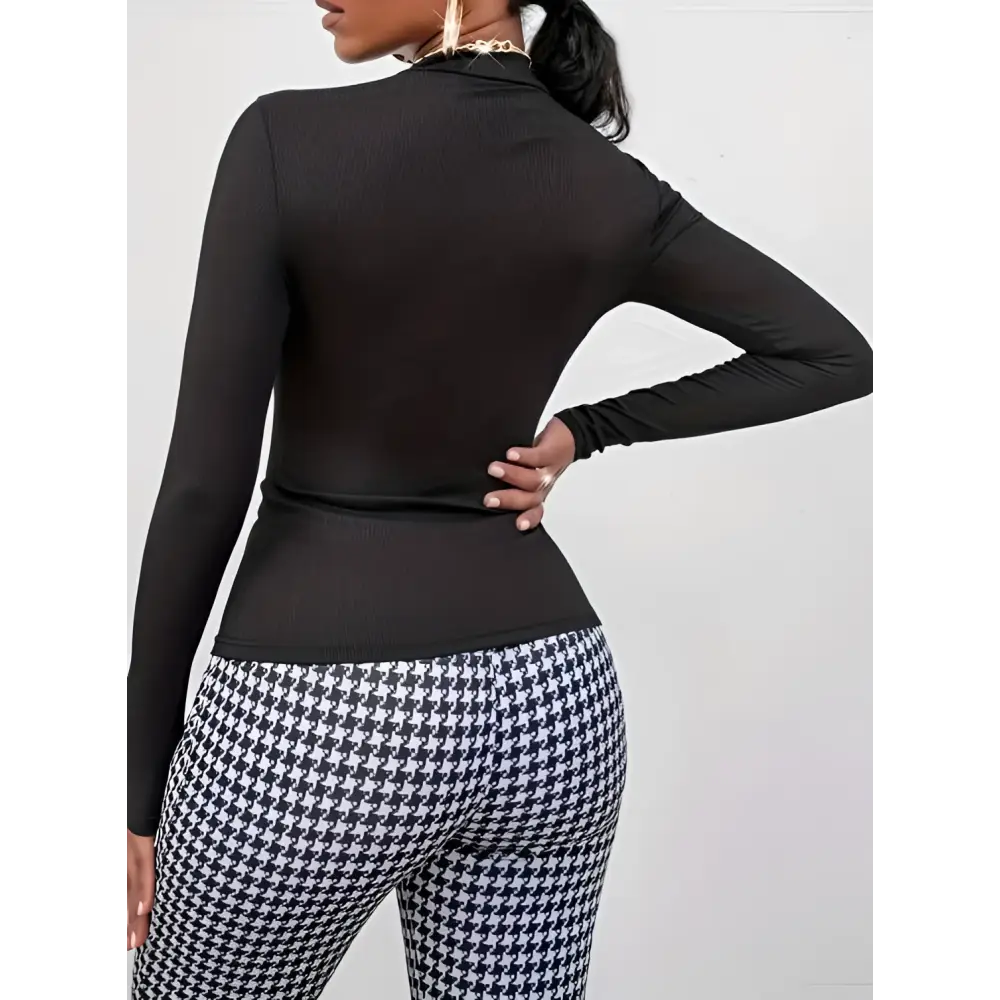 Black and white houndstooth patterned high waisted flared pants with side slits for ladies printed fashionable wear