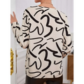 A cream-colored ladies printed fashionable loose shirt with long sleeves and bold black abstract line patterns