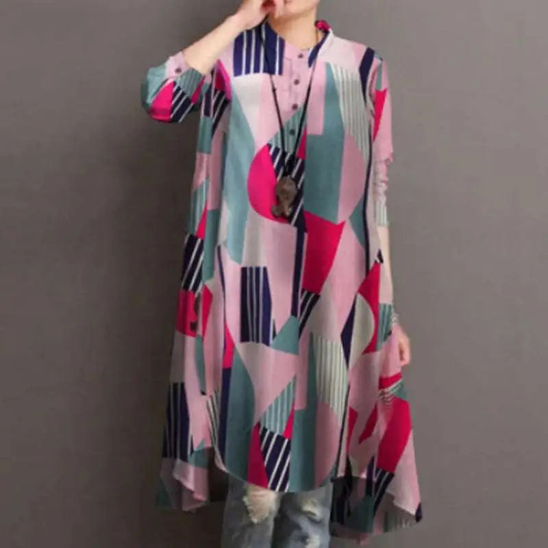 A woman wearing a ladies retro casual long-sleeved high waist tunic with a pink teal navy blue geometric pattern