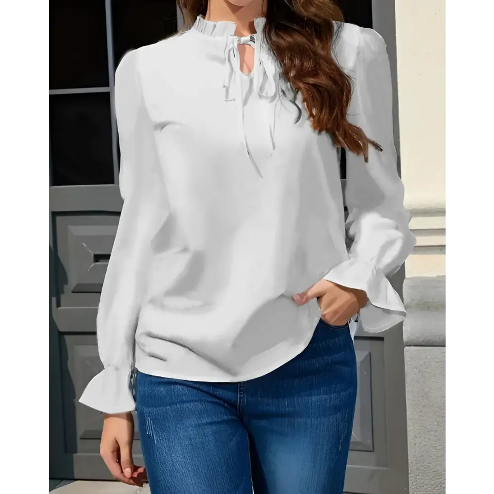 White ladies solid color blouse with lace collar ruffle cuffs and tie front neckline for elegant wear