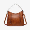Brown faux leather large capacity luxury women leather hobo bag with black shoulder strap and tassel zipper pockets