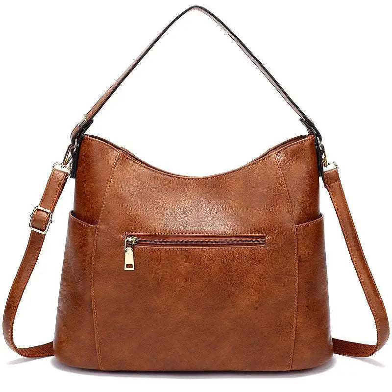 Brown large capacity luxury women leather hobo bag with single shoulder strap and adjustable crossbody strap