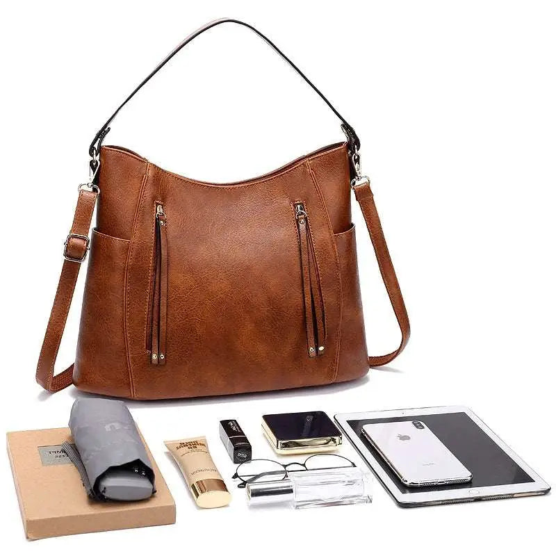 Brown large capacity luxury women leather hobo bag with curved top handle and adjustable shoulder strap