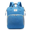 Blue textured fabric large capacity mommy bag with beige zipper pulls and living traveling share label for baby essentials