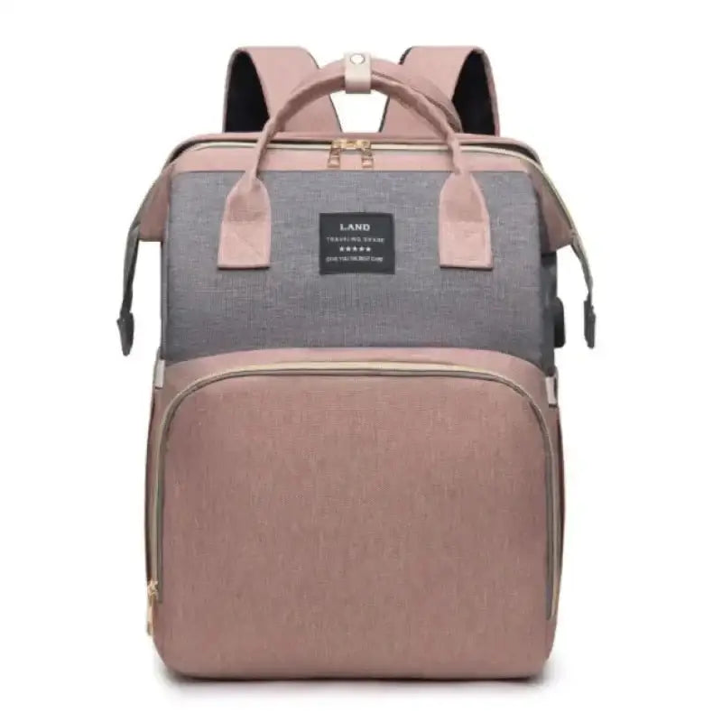 Two-tone gray and rose gold fabric large capacity mommy bag with front pocket adjustable straps and brand patch on top flap