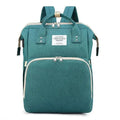 Teal fabric large capacity mommy bag with beige zipper pulls and living travel share label for baby essentials