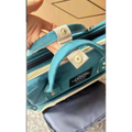 Teal velvet large capacity mommy bag with beige fabric straps and gold-tone metal hardware for baby essentials