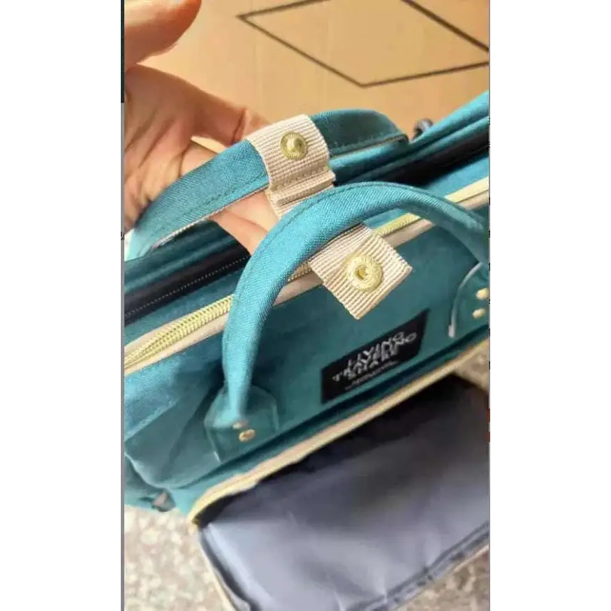 Teal velvet large capacity mommy bag with beige fabric straps and gold-tone metal hardware for baby essentials