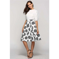 White slim fit a-line skirt with large polka dot pattern and dot round slim diagonal striped detailing inside circles