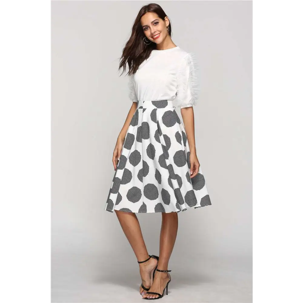 White slim fit a-line skirt with large polka dot pattern and dot round slim diagonal striped detailing inside circles