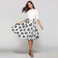 White and black large polka dot slim fit a-line skirt with striped circular patterns in a dot round slim design