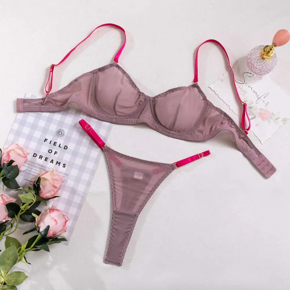 A mauve satin lavender and pink see-through two-piece set with vibrant pink straps made from comfortable fabric