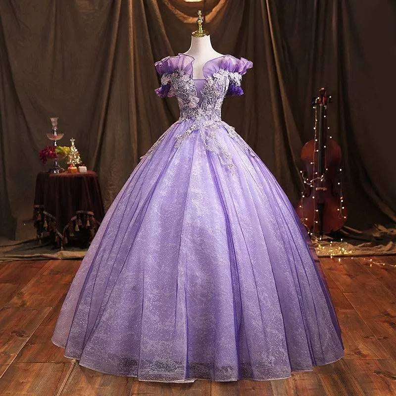 A shimmering lavender beaded bel canto solo performance costume gown with off-the-shoulder puffed sleeves on a mannequin