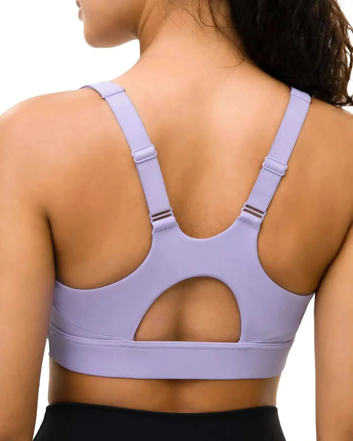 Lavender-colored sports bra with adjustable straps and cutout back design featured as part of high waist fitness attire for boosting performance.