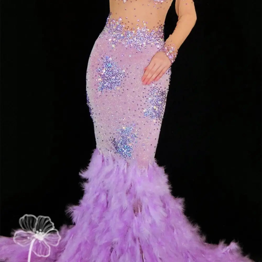 A shimmering lavender diamond feather mesh wrap hip dress with sequins and a voluminous feathered train