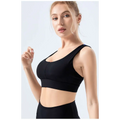 Black sports bra with supportive design and sleek form-fitting silhouette made from nylon as a seamless fitness bra