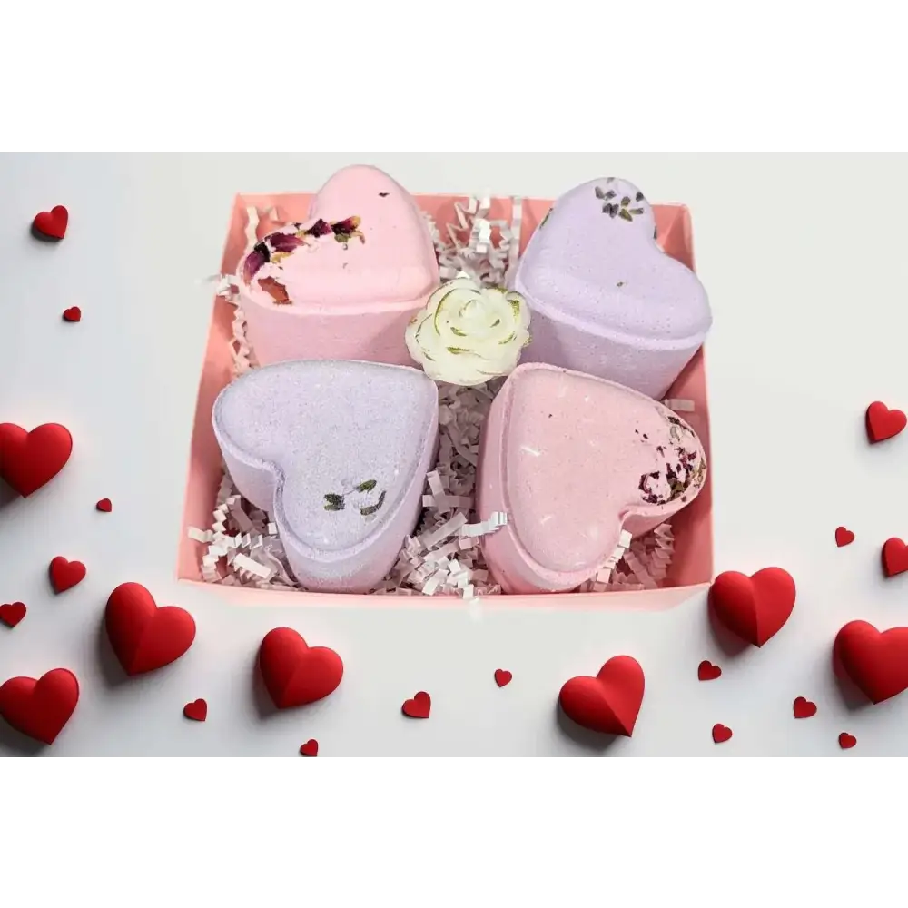 Lavender heart shower steamers gift set with pink and lavender heart-shaped bath bombs and dried flower accents in a pink box