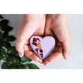 Lavender heart shower steamer with dried rose petals and gold leaf in a shower steamers gift set