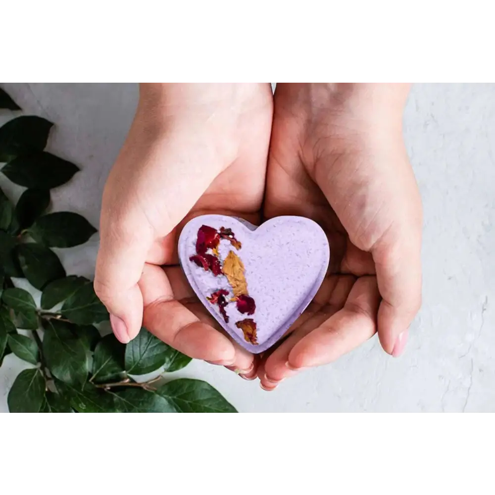 Lavender heart shower steamer with dried rose petals and gold leaf in a shower steamers gift set