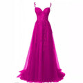 A vibrant fuchsia shoulder prom dress with lavender lace bodice and sheer tulle skirt for red carpet runway events