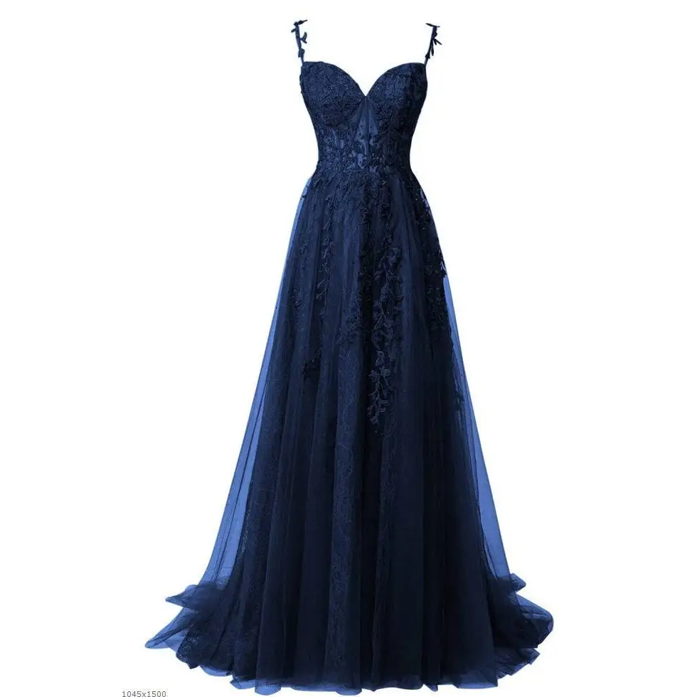 A navy blue evening gown with lace detailing and bows combines elegance and charm for red carpet runway events