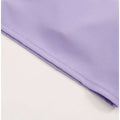 A breathable running sports bra in soft lavender ribbed fabric with subtle texture and a neatly stitched hem