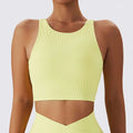 A vibrant lime green ribbed breathable running sports bra with a high neckline and shoulder straps
