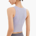 Lavender ribbed sleeveless fitness vest with chest pad features a form-fitting athletic crop top with seamless textured design