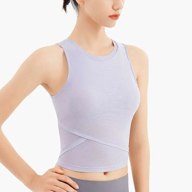 A light lavender ribbed sleeveless fitness vest with chest pad featuring a form-fitting crossed panel design