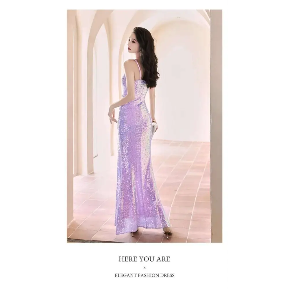 A shimmering lavender sequined evening mermaid gown with a fitted silhouette thin straps and a high slit