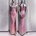 Lavender sequined evening mermaid gown with fitted bodice and high slit displayed on silver mannequins