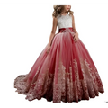 A girl wears a lavender tulle lace wedding dress with an ivory lace bodice and embroidered red to dusty rose skirt