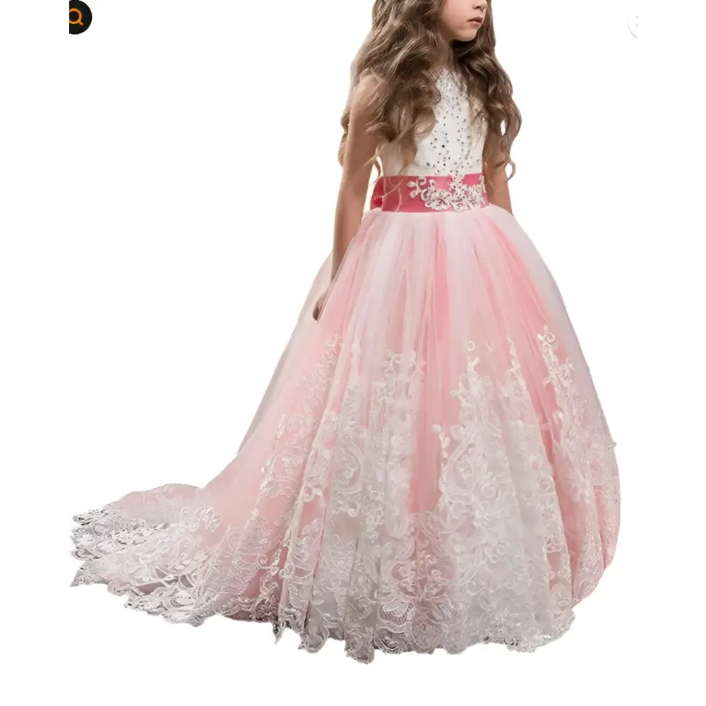 A young girl wears a pink and white lace wedding dress with lavender tulle lace and an embellished satin sash