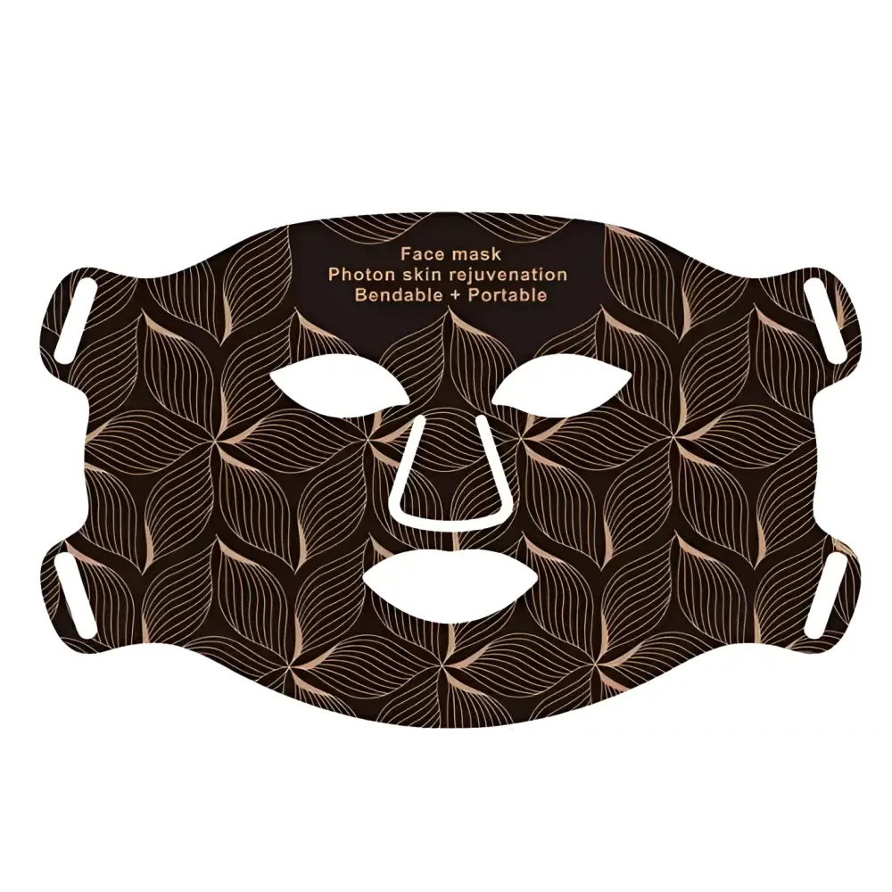 Brown face mask with leaf pattern and white cutouts for eyes nose and mouth skin texture rejuvenation beauty apparatus