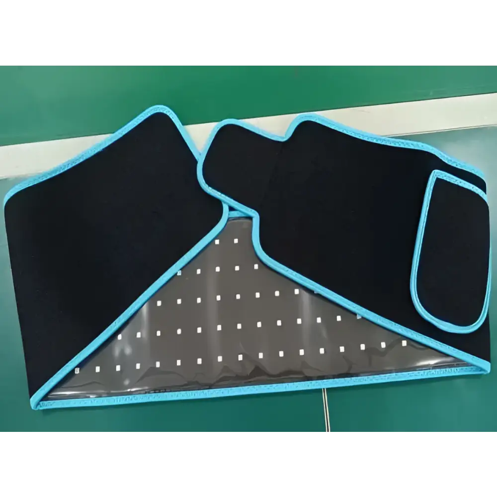 Black elastic led infrared belt with light blue trim and transparent dotted mesh panel for belt therapy device