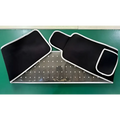 Black fabric led infrared belt therapy device with white stitched edges and perforated metal panel for infrared heating red