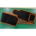 Black and orange led infrared belt therapy device with textured fabric exterior and visible infrared heating red elements inside