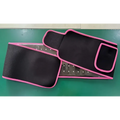 Black waist trainer led infrared belt therapy device with pink trim and built-in mesh panel for infrared heating red support