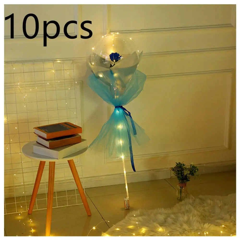 Luminous balloon rose bouquet featuring a blue rose inside a transparent bobo ball wrapped in turquoise tulle