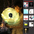 A glowing translucent transparent bobo ball with a dark blue luminous balloon rose bouquet at its center