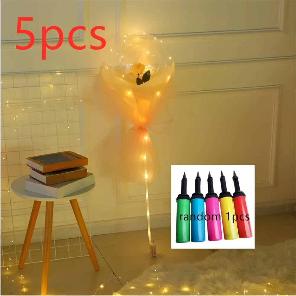 A glowing transparent bobo ball luminous balloon rose bouquet with yellow flower design wrapped in orange tulle with led lights
