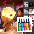 A glowing luminous balloon rose bouquet featuring a red rose inside a transparent bobo ball wrapped in brown paper