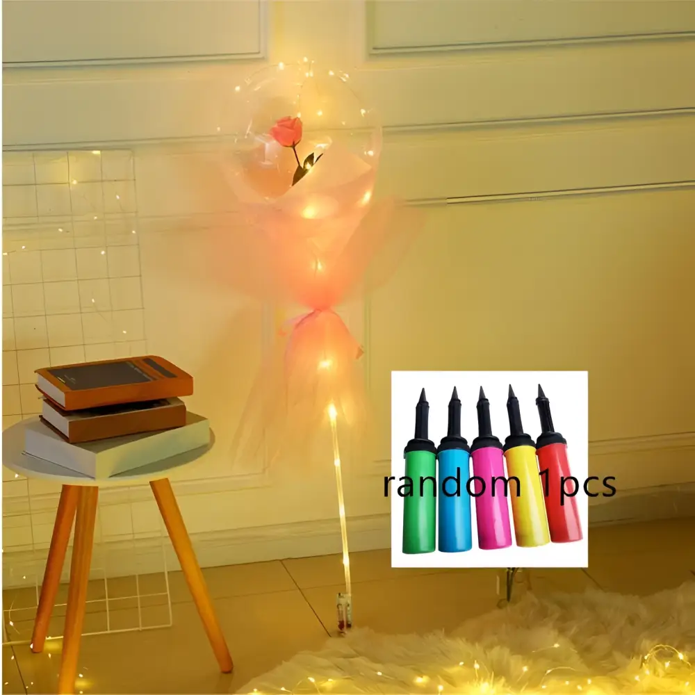 Translucent luminous balloon rose bouquet with a pink rose inside wrapped in sheer tulle inside a transparent bobo ball