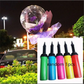 A clear transparent bobo ball luminous balloon rose bouquet filled with purple flowers and twinkling lights
