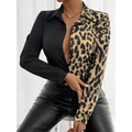 A stylish leopard print belted shirt with a black collar long sleeves and button-down front for elegant wear